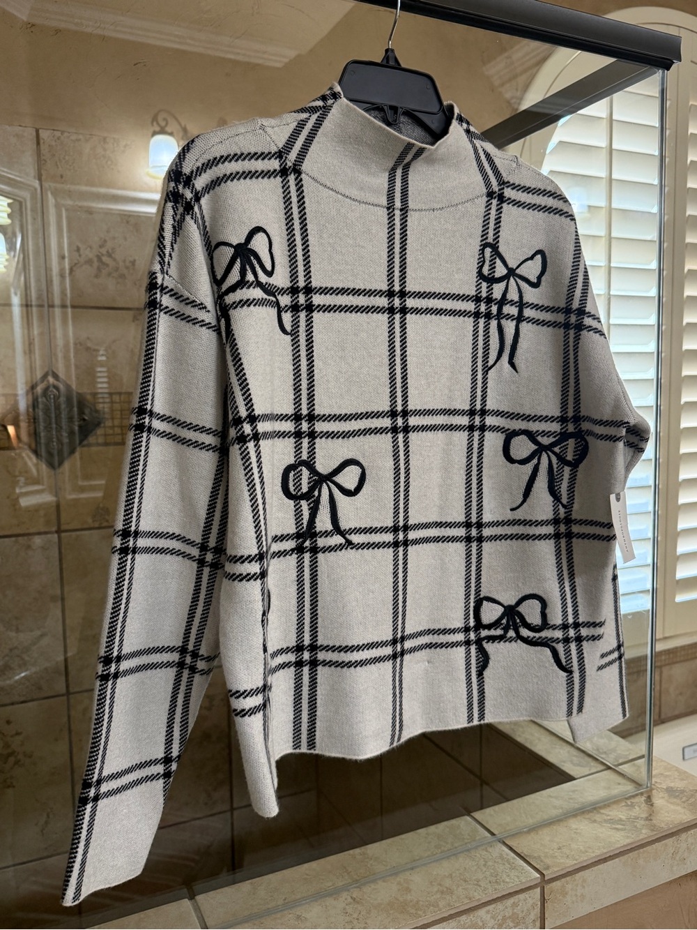 Maeve Cream and Black Plaid Mock Neck Sweater with Bow Accents